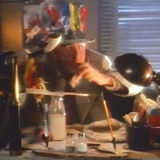 A man in a hat is making something on the table
